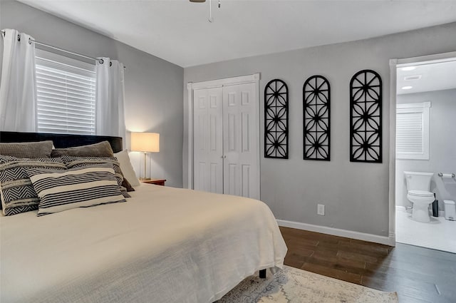 514 W Baker St, Denison, TX 75020 - bedroom with dark wood finished floors, baseboards, a closet, ceiling fan, and ensuite bathroom