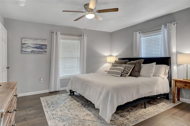 514 W Baker St, Denison, TX 75020 - bedroom with dark wood finished floors, multiple windows, and a ceiling fan