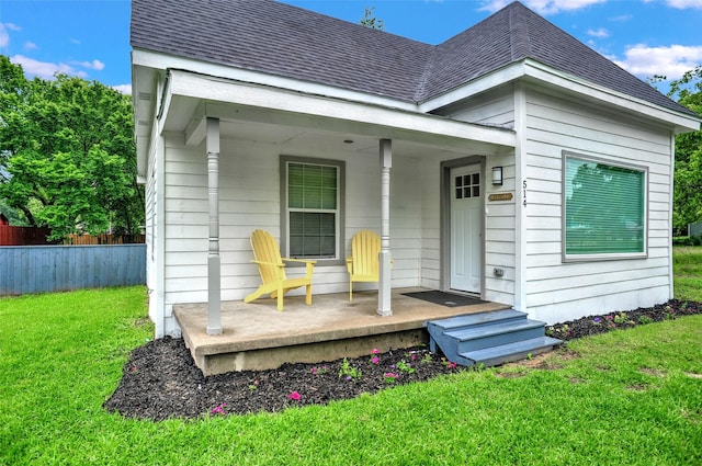 514 W Baker St, Denison, TX 75020 - rear view of house with a porch and a shingled roof