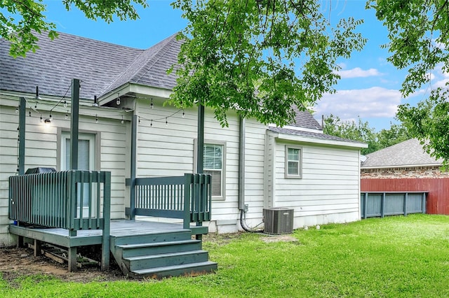 514 W Baker St, Denison, TX 75020 - rear view of property with roof with shingles, a wooden deck, and central AC