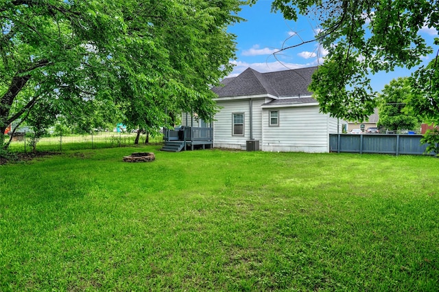 514 W Baker St, Denison, TX 75020 - view of yard featuring a fire pit and central AC unit