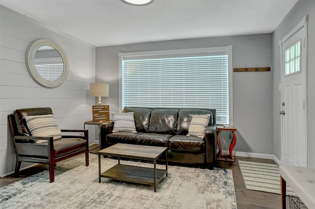 514 W Baker St, Denison, TX 75020 - living room with baseboards, wooden walls, and wood finished floors