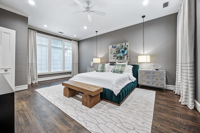 bedroom with ornamental molding, wood finished floors, baseboards, and recessed lighting