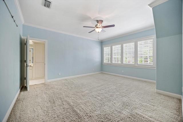 unfurnished room with ornamental molding, carpet flooring, ceiling fan, and baseboards