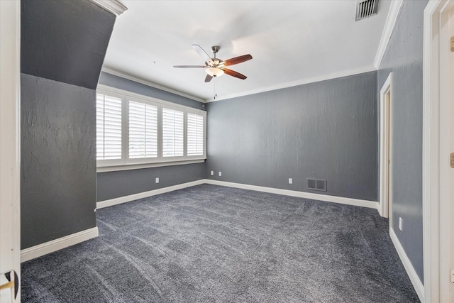 unfurnished room with a ceiling fan, crown molding, carpet flooring, and baseboards