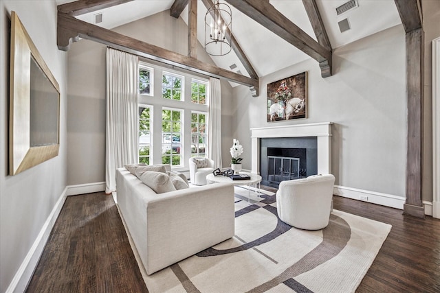 living room with wood finished floors, beamed ceiling, a fireplace, baseboards, and high vaulted ceiling