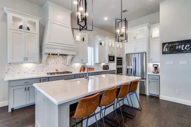 2813 Dorset, The Colony, TX 75056 - kitchen featuring stainless steel appliances, dark wood finished floors, custom exhaust hood, light countertops, and recessed lighting