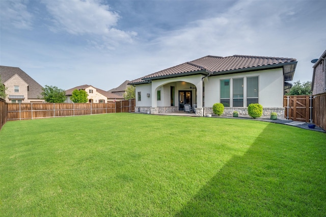 2813 Dorset, The Colony, TX 75056 - back of property featuring stone siding, stucco siding, and a tile roof