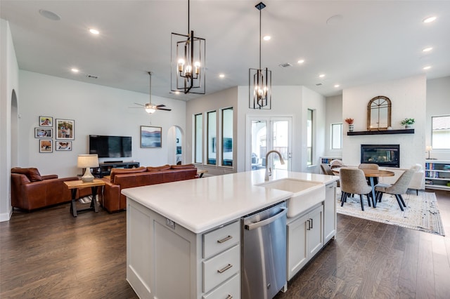 2813 Dorset, The Colony, TX 75056 - kitchen featuring open floor plan, stainless steel dishwasher, a sink, arched walkways, and recessed lighting