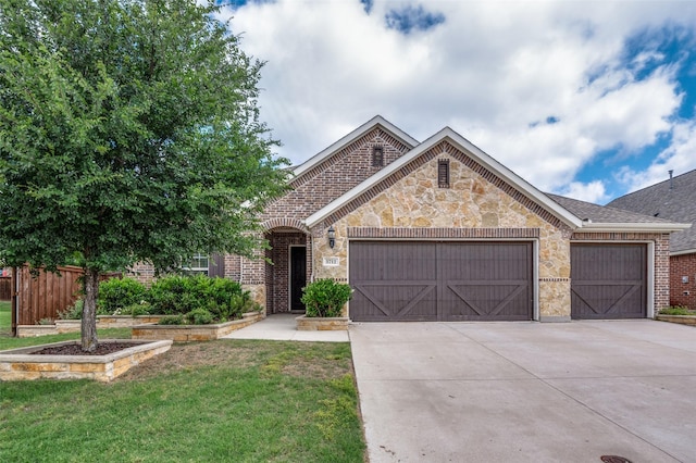 5712 Demi Sec Dr, Mckinney, TX 75070 - view of front facade featuring a garage, concrete driveway, and brick siding