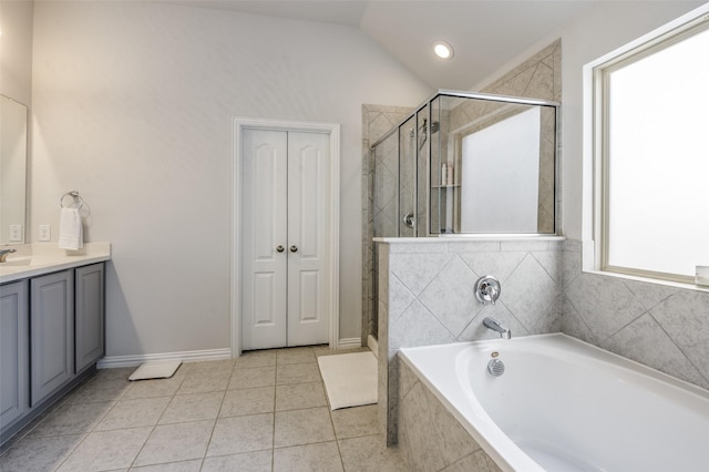 5712 Demi Sec Dr, Mckinney, TX 75070 - bathroom with vanity, a stall shower, tile patterned flooring, a bath, and lofted ceiling