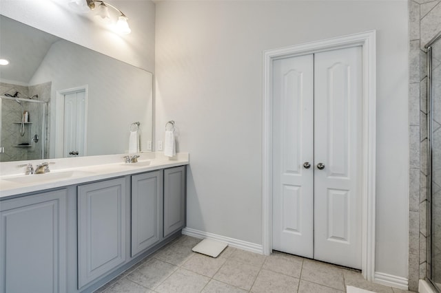 5712 Demi Sec Dr, Mckinney, TX 75070 - full bathroom featuring a stall shower, double vanity, baseboards, and tile patterned flooring