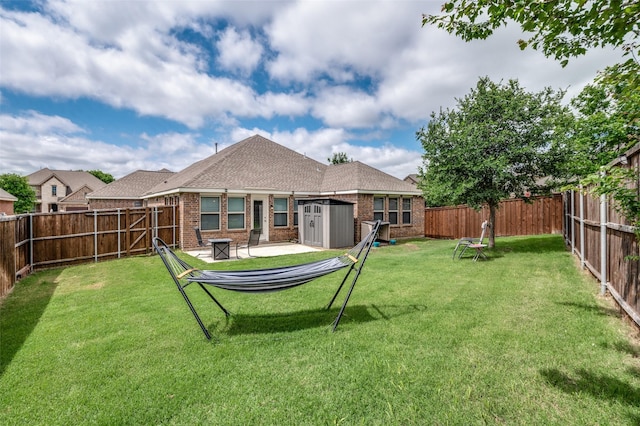 5712 Demi Sec Dr, Mckinney, TX 75070 - back of house with a shed, brick siding, an outdoor structure, and roof with shingles