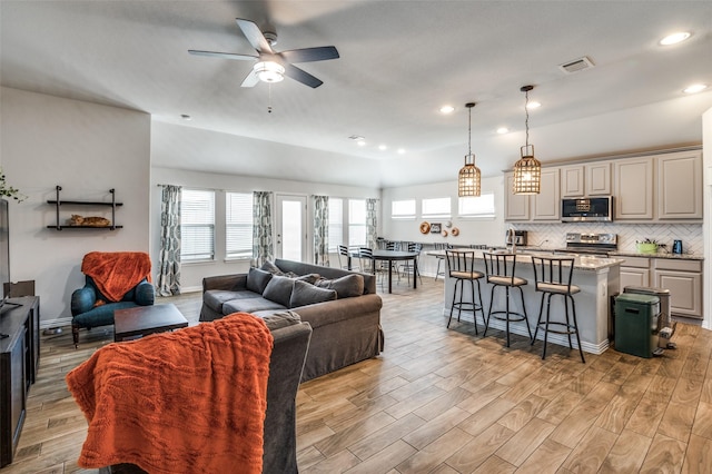 5712 Demi Sec Dr, Mckinney, TX 75070 - living area with ceiling fan, light wood-style floors, and recessed lighting