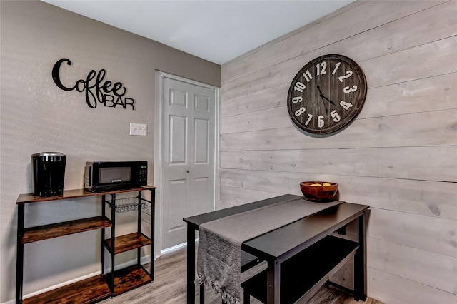 401 W Acheson St, Denison, TX 75020 - dining area with wood finished floors and wooden walls