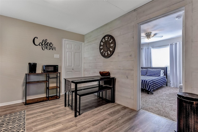 401 W Acheson St, Denison, TX 75020 - office space with wood finished floors, ceiling fan, and wooden walls