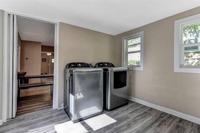 401 W Acheson St, Denison, TX 75020 - washroom with washing machine and clothes dryer, wood finished floors, and healthy amount of natural light
