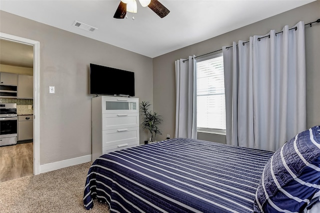 401 W Acheson St, Denison, TX 75020 - bedroom with light colored carpet, baseboards, and ceiling fan