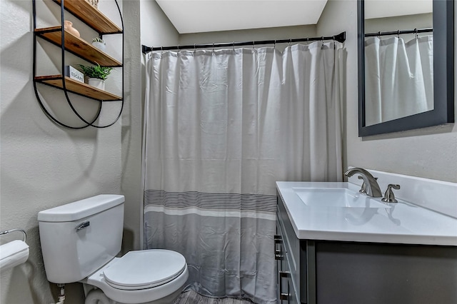401 W Acheson St, Denison, TX 75020 - bathroom featuring toilet and vanity