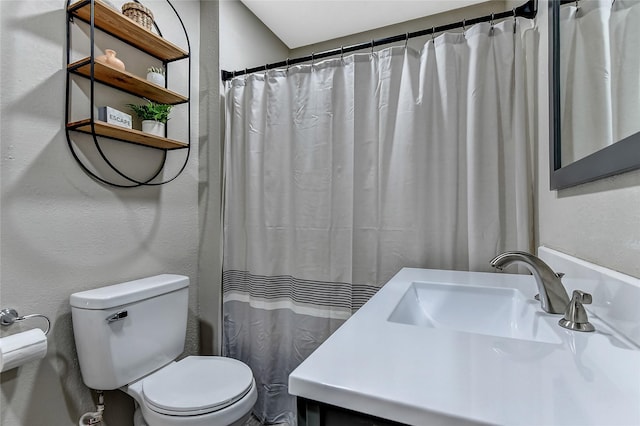 401 W Acheson St, Denison, TX 75020 - bathroom featuring toilet, vanity, and a shower with shower curtain