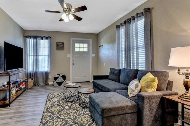 401 W Acheson St, Denison, TX 75020 - living room with ceiling fan, wood finished floors, and baseboards