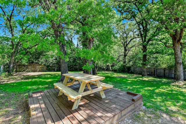 401 W Acheson St, Denison, TX 75020 - wooden terrace with outdoor dining area and view of wooded area