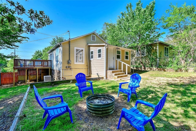 401 W Acheson St, Denison, TX 75020 - rear view of property with central AC unit, entry steps, a deck, and a fire pit