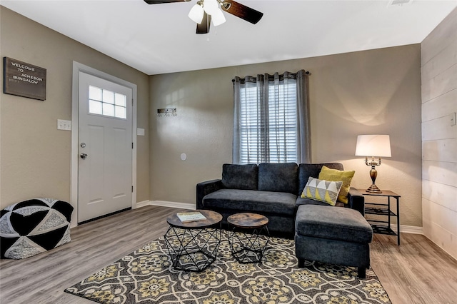 401 W Acheson St, Denison, TX 75020 - living room with ceiling fan, wood finished floors, and baseboards
