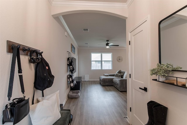 816 Killam Dr, Temple, TX 76502 - hallway featuring arched walkways, ornamental molding, wood finished floors, and baseboards