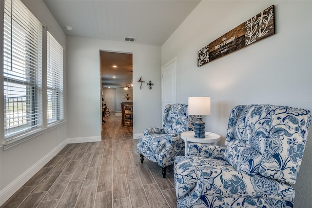 living area featuring wood finished floors and baseboards