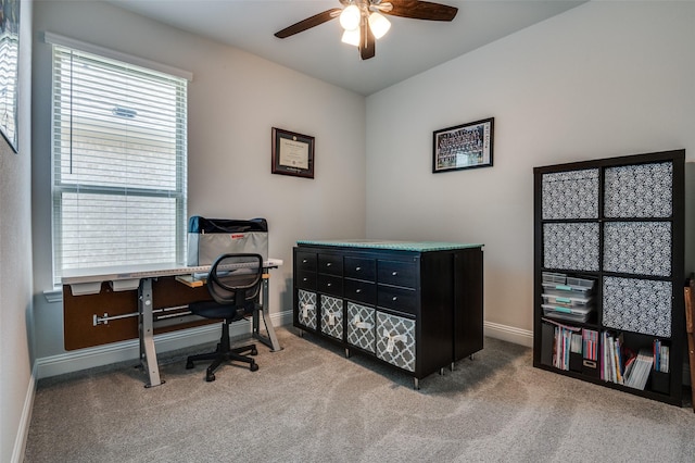 home office featuring baseboards, a ceiling fan, and carpet flooring