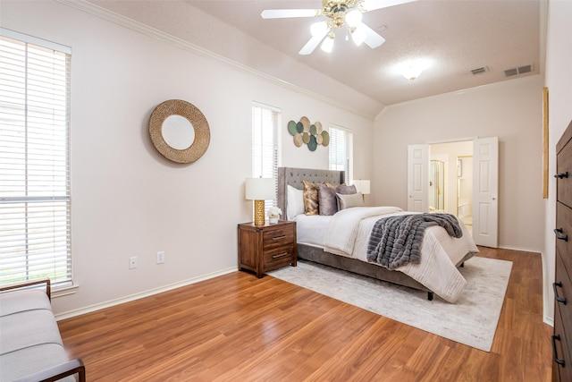 3104 Ridge Hollow Dr, Plano, TX 75023 - bedroom featuring crown molding, light wood finished floors, baseboards, vaulted ceiling, and a ceiling fan