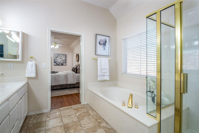 3104 Ridge Hollow Dr, Plano, TX 75023 - ensuite bathroom featuring vanity, baseboards, a bath, lofted ceiling, and a stall shower