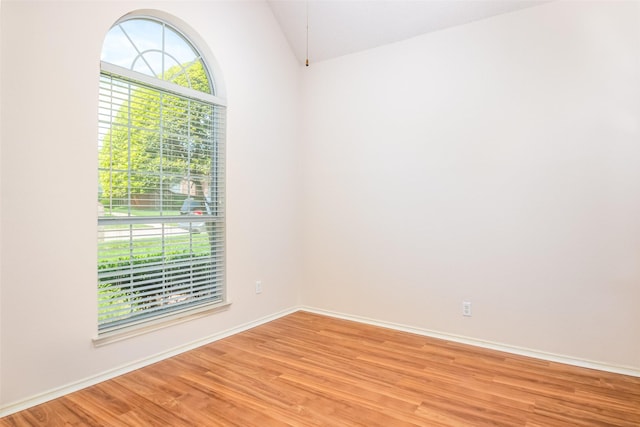 3104 Ridge Hollow Dr, Plano, TX 75023 - spare room with light wood-style flooring, lofted ceiling, and baseboards