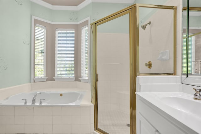 bathroom with a bath, a shower stall, plenty of natural light, vanity, and ornamental molding
