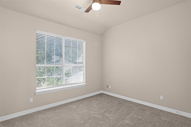 carpeted empty room with a ceiling fan and baseboards