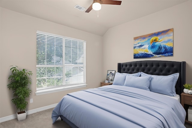 bedroom with baseboards, carpet flooring, vaulted ceiling, and ceiling fan