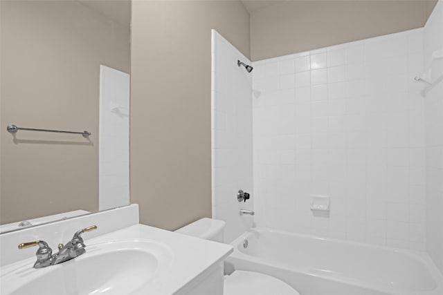 bathroom featuring toilet, shower / washtub combination, and vanity