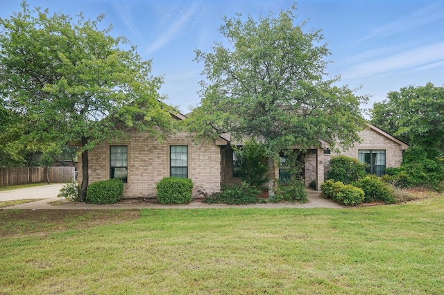 146 Country Oaks Rd, Clyde, TX 79510 - obstructed view of property featuring brick siding