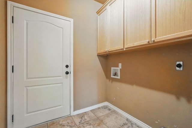 146 Country Oaks Rd, Clyde, TX 79510 - laundry room featuring cabinet space, hookup for a washing machine, hookup for an electric dryer, baseboards, and light tile patterned floors
