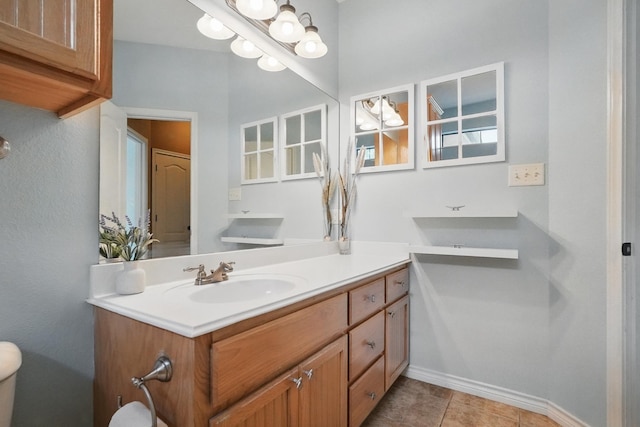 146 Country Oaks Rd, Clyde, TX 79510 - bathroom featuring vanity, baseboards, toilet, and tile patterned flooring
