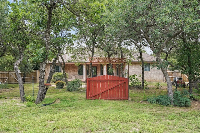 146 Country Oaks Rd, Clyde, TX 79510 - back of property featuring brick siding and a gate