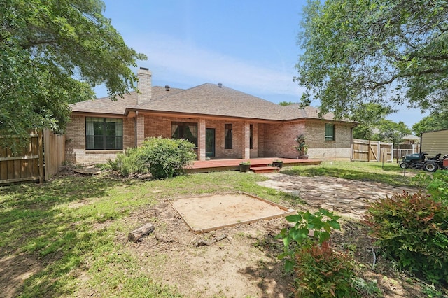 146 Country Oaks Rd, Clyde, TX 79510 - back of property with brick siding, a chimney, a patio area, a shingled roof, and a deck