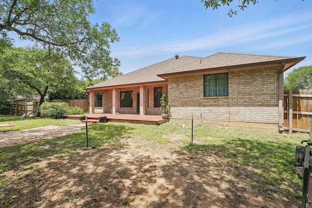 146 Country Oaks Rd, Clyde, TX 79510 - back of house with brick siding, roof with shingles, and a deck