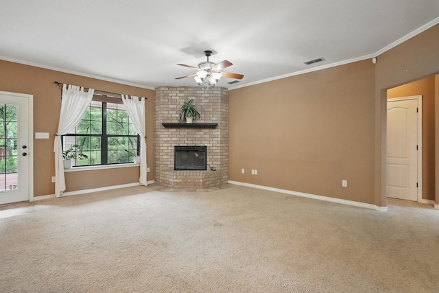 146 Country Oaks Rd, Clyde, TX 79510 - unfurnished living room with a ceiling fan, ornamental molding, carpet floors, a brick fireplace, and baseboards