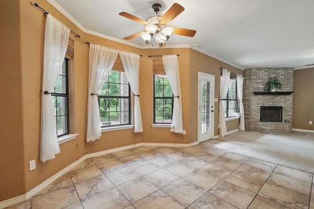 146 Country Oaks Rd, Clyde, TX 79510 - unfurnished living room featuring crown molding, baseboards, ceiling fan, and a fireplace