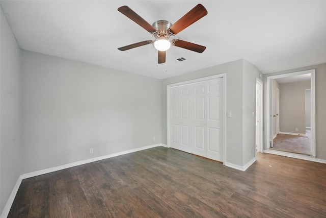 2906 W Parnell St, Denison, TX 75020 - unfurnished bedroom featuring baseboards, dark wood-type flooring, a closet, and ceiling fan