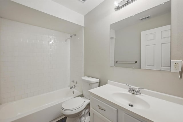2906 W Parnell St, Denison, TX 75020 - bathroom featuring toilet, vanity, and tub / shower combination