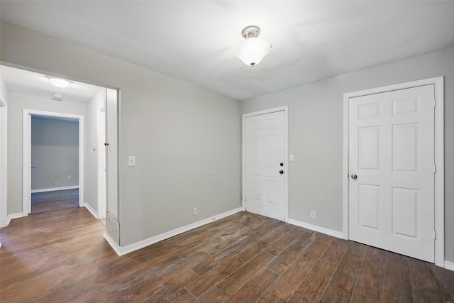 2906 W Parnell St, Denison, TX 75020 - unfurnished bedroom featuring dark wood-style floors, baseboards, and a closet