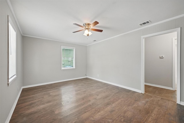 2906 W Parnell St, Denison, TX 75020 - spare room featuring ornamental molding, ceiling fan, wood finished floors, and baseboards